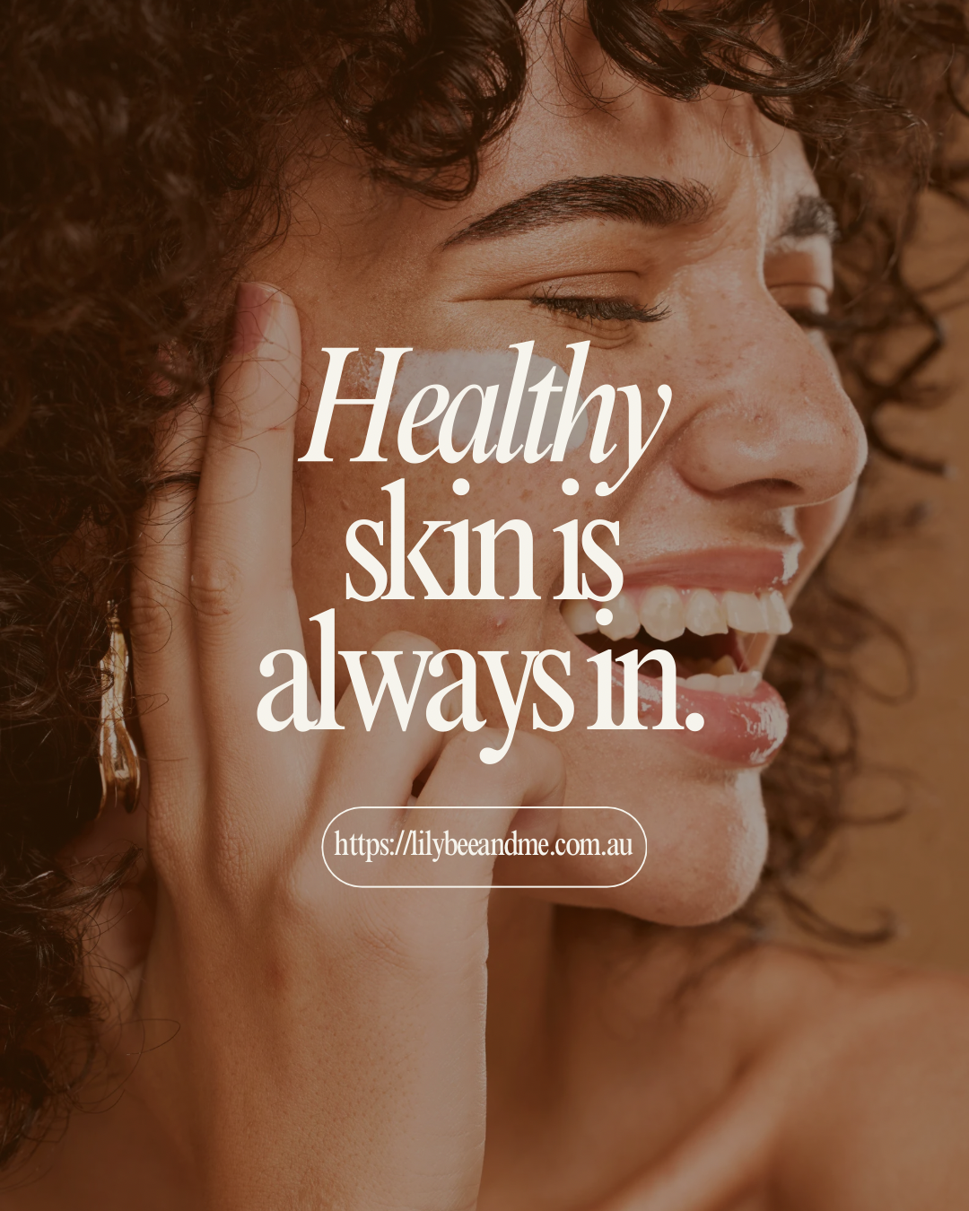 Woman with a smile and text overlay 'Healthy skin is always in.' on a brown background