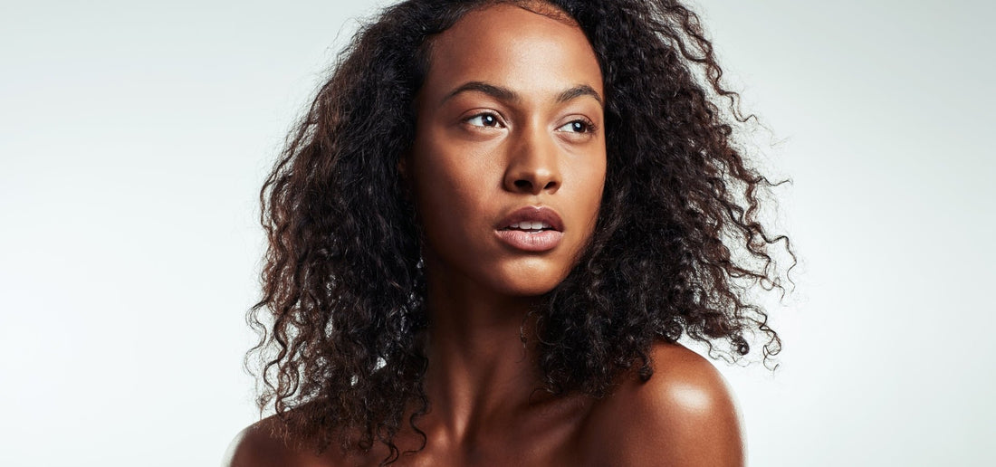 Close-up of facial serum dropper dispensing high-potency skincare serum for use on face and body