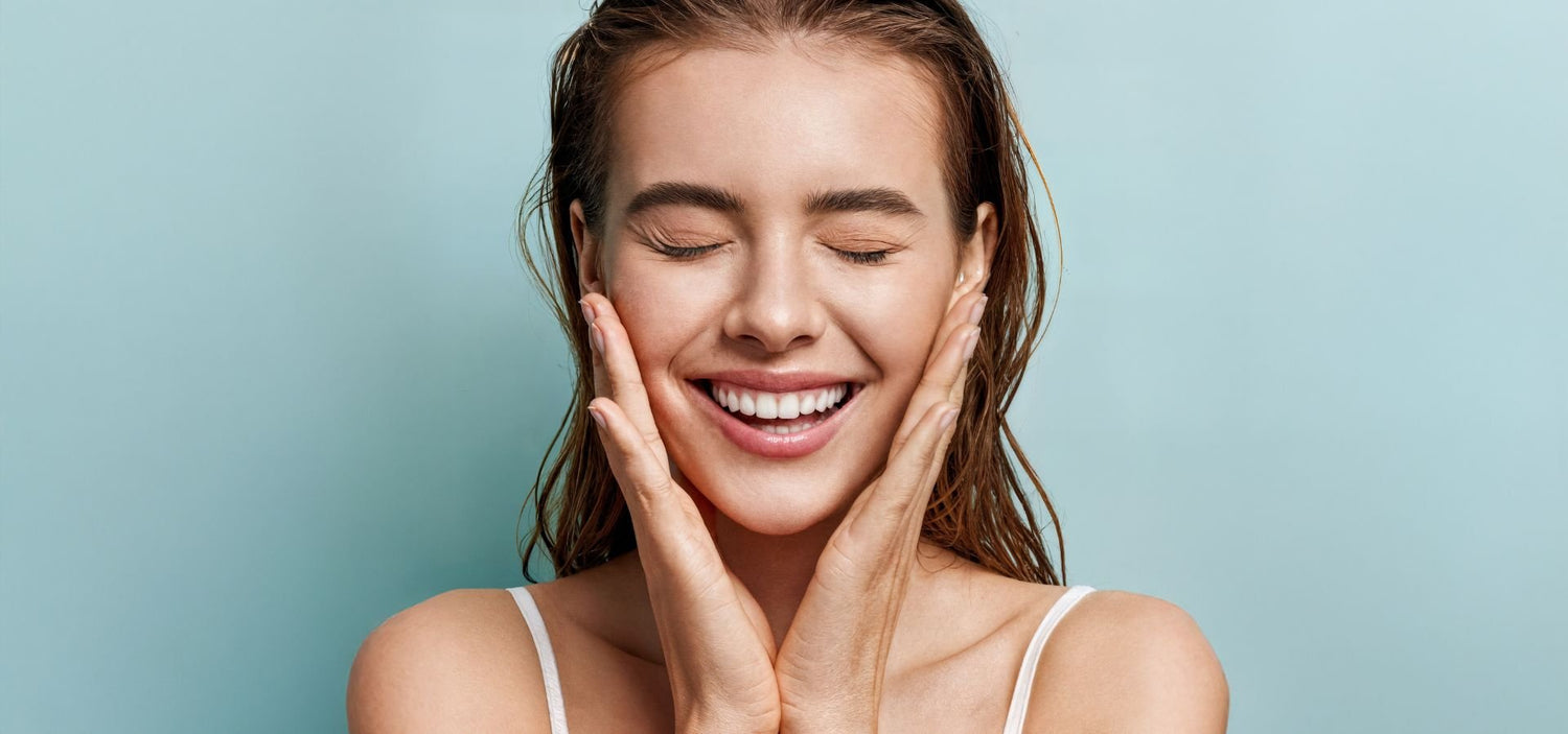 Woman with a radiant smile and hands on her face - All natural skincare. Vegan friendly and Toxin-Free Safe skincare - Lily Bee and Me